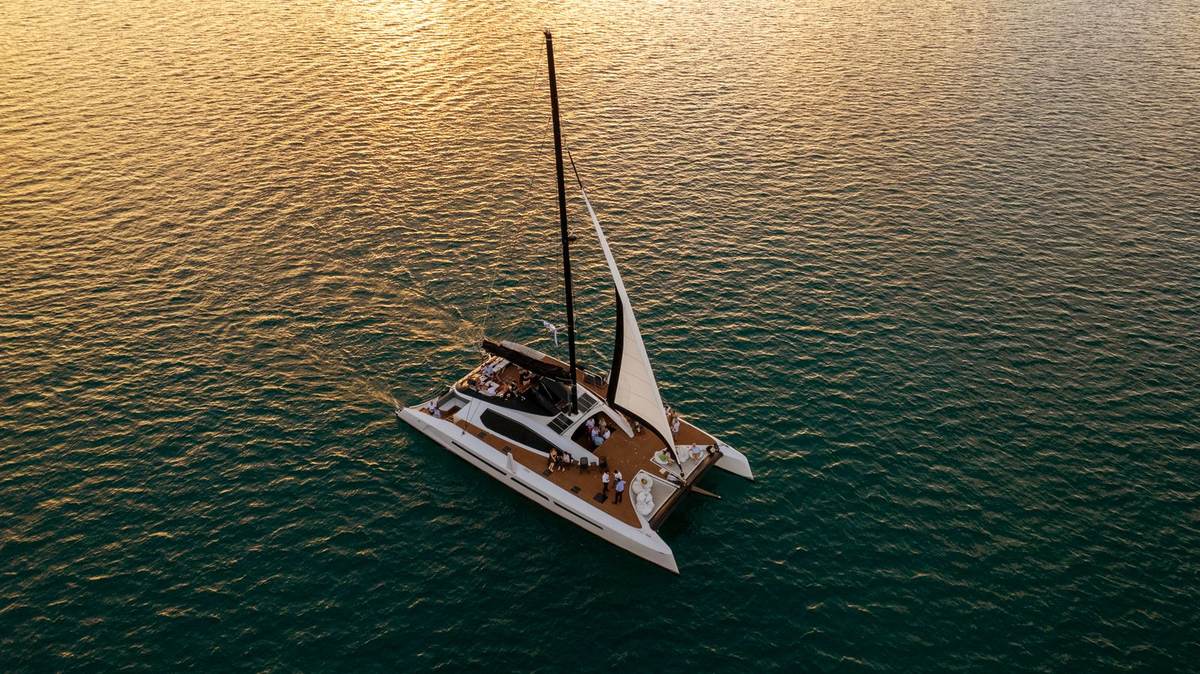 Privately crewed catamaran off the west coast of Mauritius at dawn